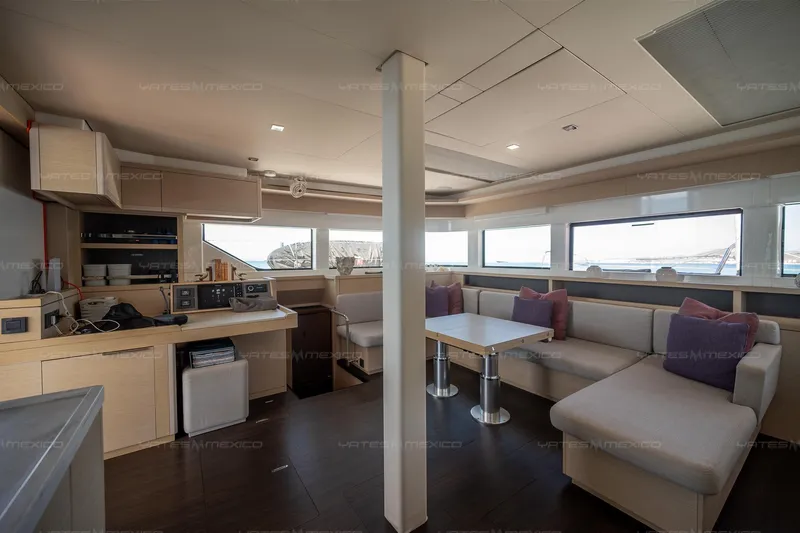  Yacht Photos Pics Luxurious interior of 2023 Lagoon 55 yacht with modern kitchen and seating area.