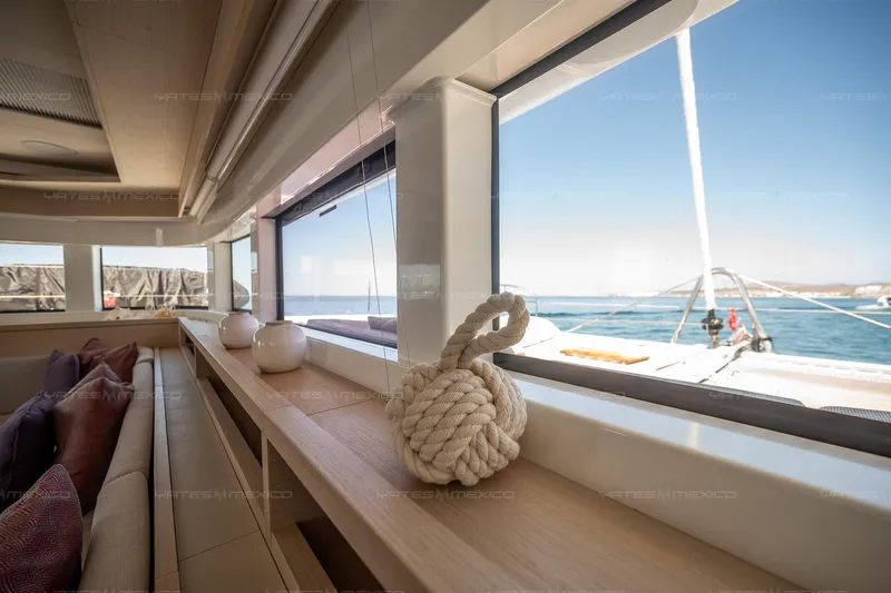  Yacht Photos Pics Interior of 2023 Lagoon 55 yacht with ocean view through large windows.