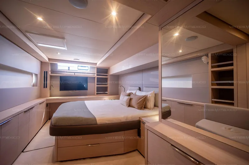  Yacht Photos Pics Luxurious bedroom interior of 2023 Lagoon 55 yacht, featuring modern design and elegant furnishings.