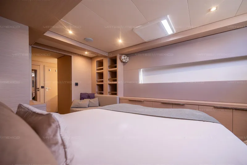  Yacht Photos Pics Luxurious interior of 2023 Lagoon 55 yacht, featuring a spacious bedroom with modern design.