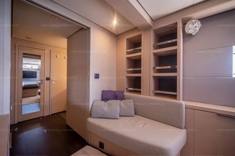  Yacht Photos Pics Luxurious interior of 2023 Lagoon 55 yacht with modern seating and shelving.