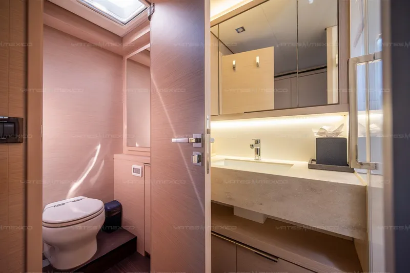  Yacht Photos Pics Luxurious bathroom interior of 2023 Lagoon 55 yacht, featuring modern fixtures and elegant design.