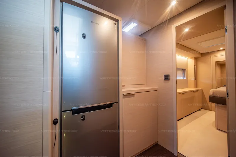  Yacht Photos Pics Modern interior of 2023 Lagoon 55 yacht featuring sleek kitchen and cozy cabin.