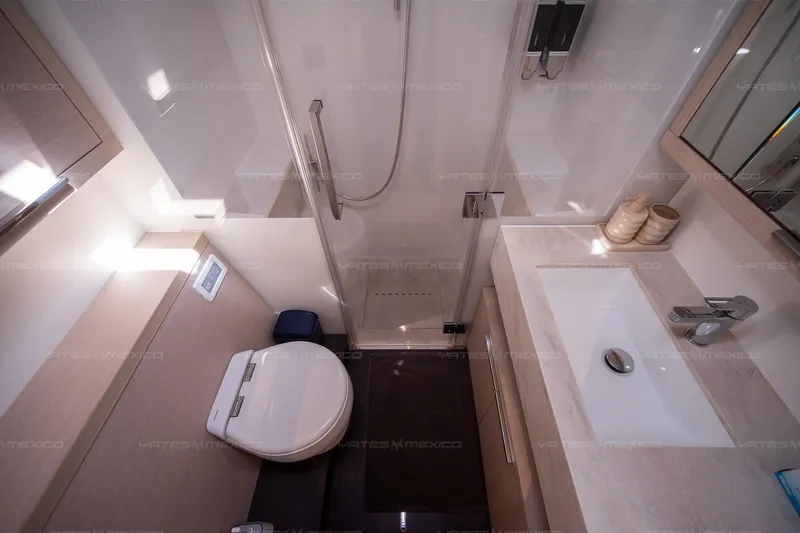  Yacht Photos Pics Modern bathroom interior on 2023 Lagoon 55 yacht, featuring sleek design and amenities.