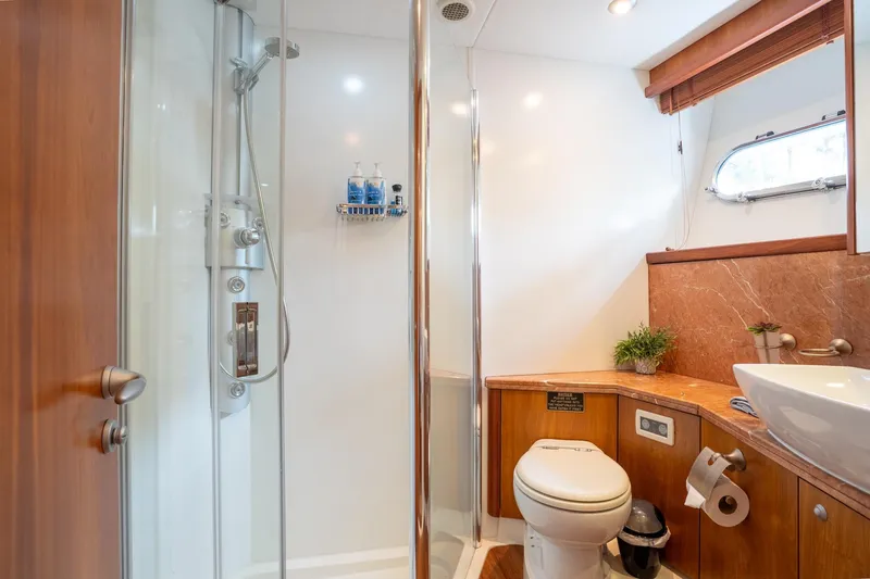  Yacht Photos Pics Luxurious bathroom in 2008 Sunseeker Manhattan 70 yacht with shower and modern amenities.