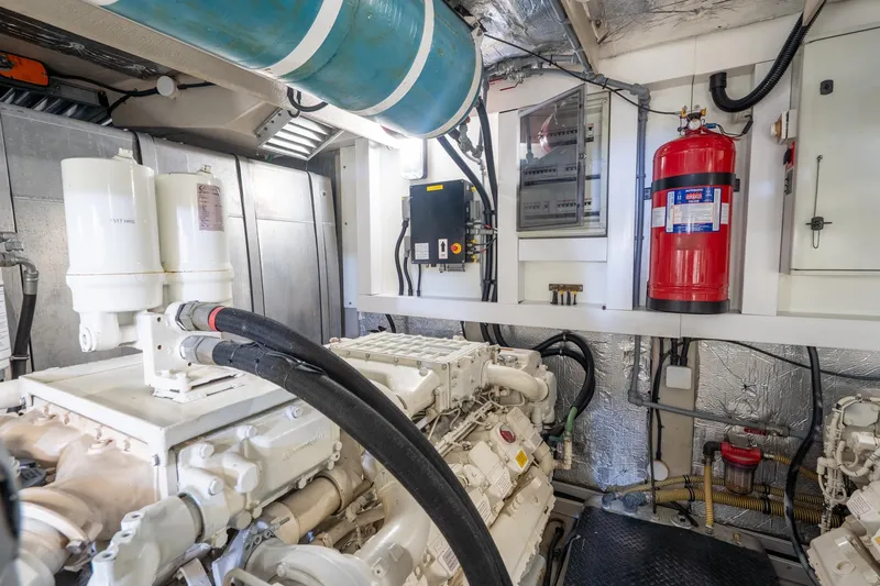  Yacht Photos Pics Engine room of 2008 Sunseeker Manhattan 70 yacht, featuring machinery and safety equipment.