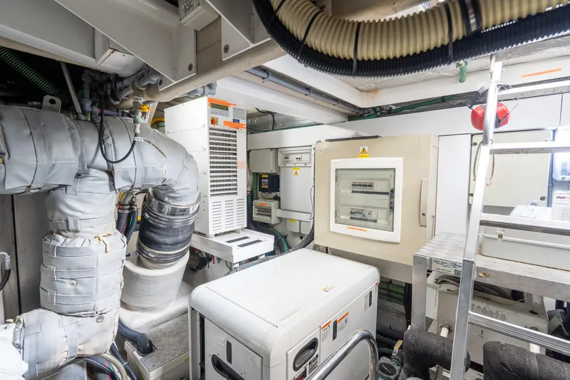  Yacht Photos Pics Engine room of 2008 Sunseeker Manhattan 70 yacht, featuring complex machinery and control panels.