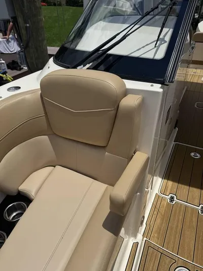  Yacht Photos Pics 2023 Scout 277 Dorado boat with beige seating and teak flooring.