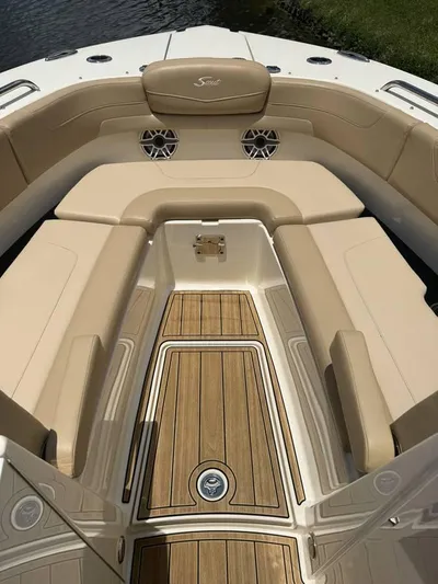  Yacht Photos Pics 2023 Scout 277 Dorado boat interior with tan seating and teak flooring.
