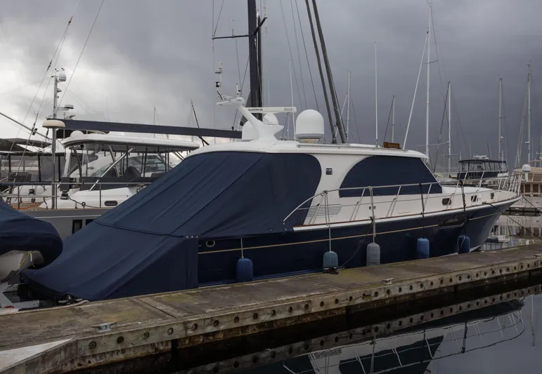 Yeomalt Yacht Photos Pics 2014 Grand Banks 50 Eastbay SX yacht docked at marina under cloudy sky.