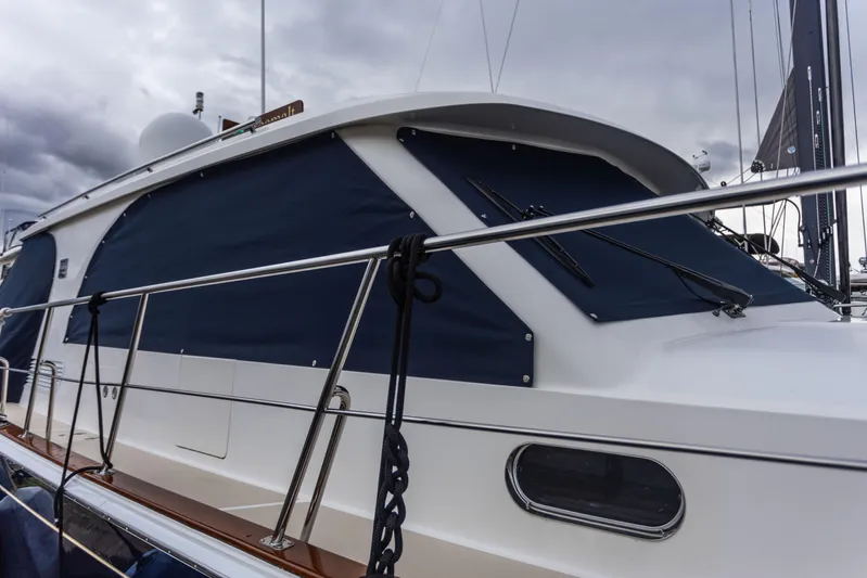 Yeomalt Yacht Photos Pics 2014 Grand Banks 50 Eastbay SX yacht with covered windows docked.