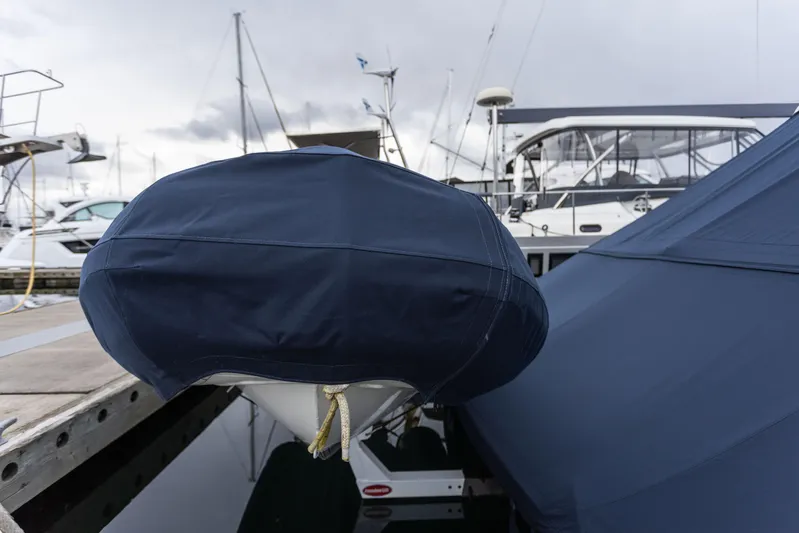 Yeomalt Yacht Photos Pics Covered bow of a 2014 Grand Banks 50 Eastbay SX at a marina.