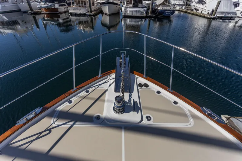 Yeomalt Yacht Photos Pics Bow view of 2014 Grand Banks 50 Eastbay SX yacht docked in marina.