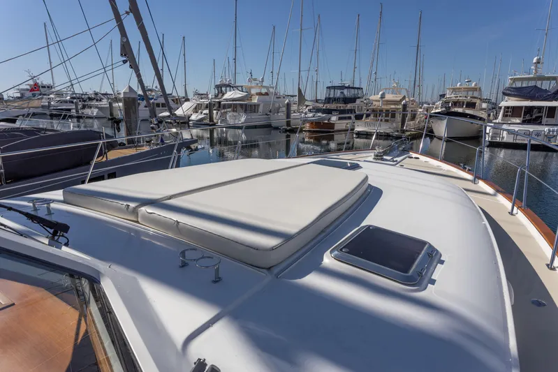 Yeomalt Yacht Photos Pics 2014 Grand Banks 50 Eastbay SX yacht docked in a marina.