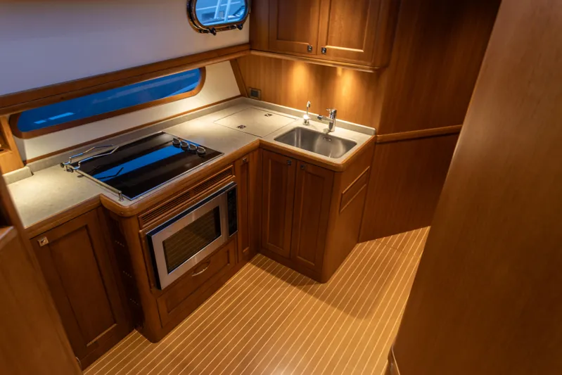 Yeomalt Yacht Photos Pics Luxurious kitchen area in a 2014 Grand Banks 50 Eastbay SX yacht.