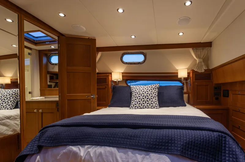 Yeomalt Yacht Photos Pics Luxurious bedroom interior of 2014 Grand Banks 50 Eastbay SX yacht.