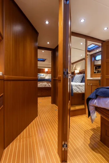 Yeomalt Yacht Photos Pics Interior of 2014 Grand Banks 50 Eastbay SX yacht with wooden flooring and cozy cabins.