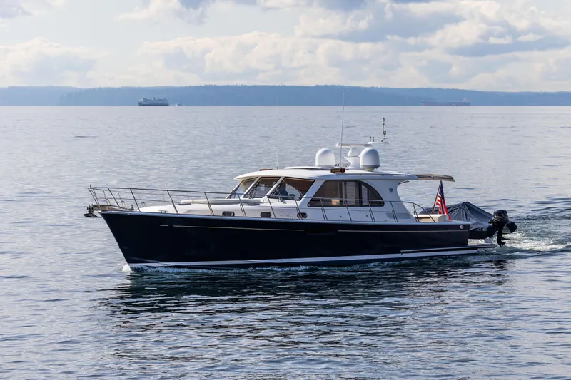 Yeomalt Yacht Photos Pics 2014 Grand Banks 50 Eastbay SX yacht cruising on calm waters.