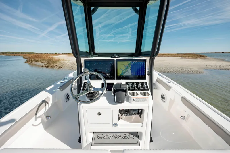  Yacht Photos Pics 2024 Caymas 281 HB boat console with navigation screens and steering wheel.