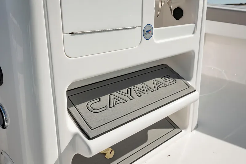  Yacht Photos Pics 2024 Caymas 281 HB boat interior detail with branded mat.