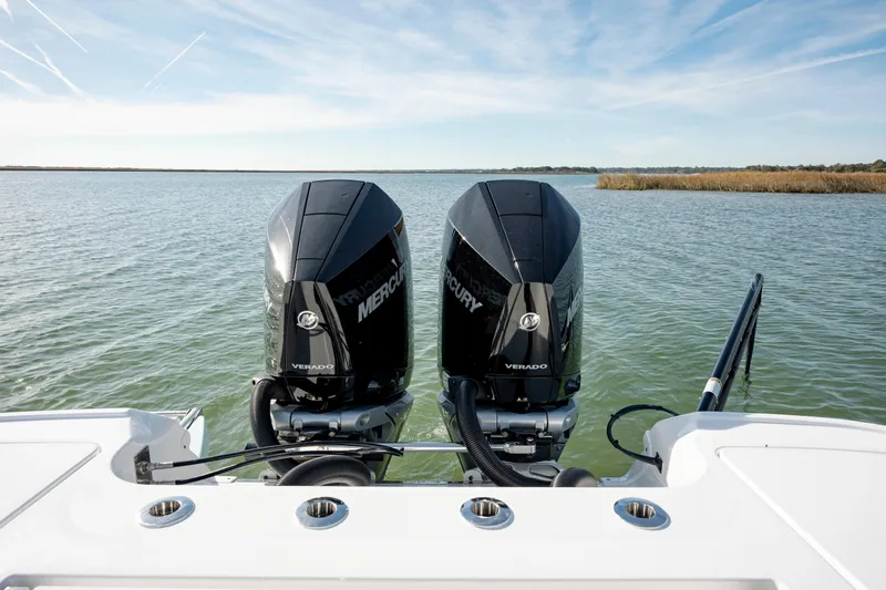  Yacht Photos Pics 2024 Caymas 281 HB with twin Mercury Verado engines on open water.