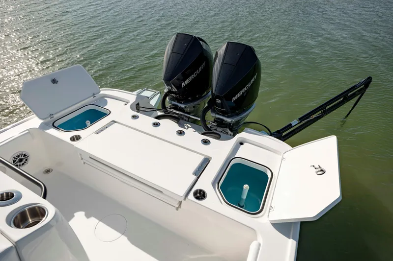  Yacht Photos Pics 2024 Caymas 281 HB boat with dual Mercury engines on water.