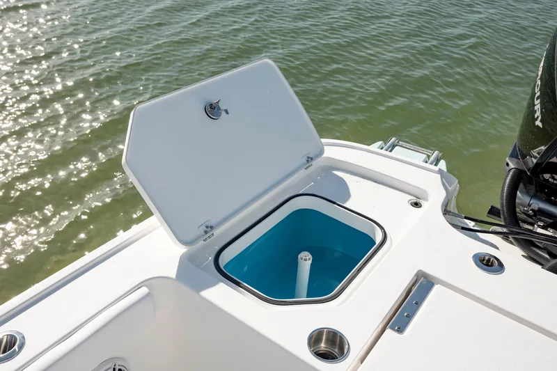  Yacht Photos Pics 2024 Caymas 281 HB boat with open storage compartment on deck.