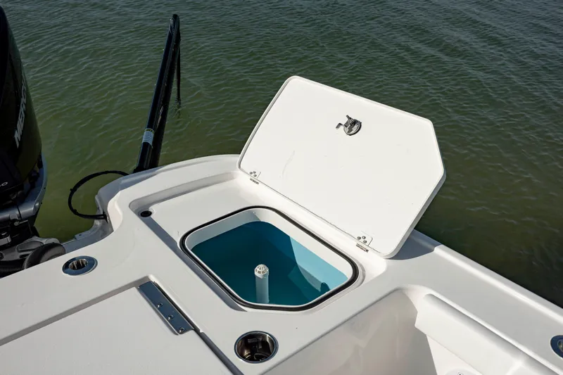  Yacht Photos Pics 2024 Caymas 281 HB boat with open storage compartment on deck.