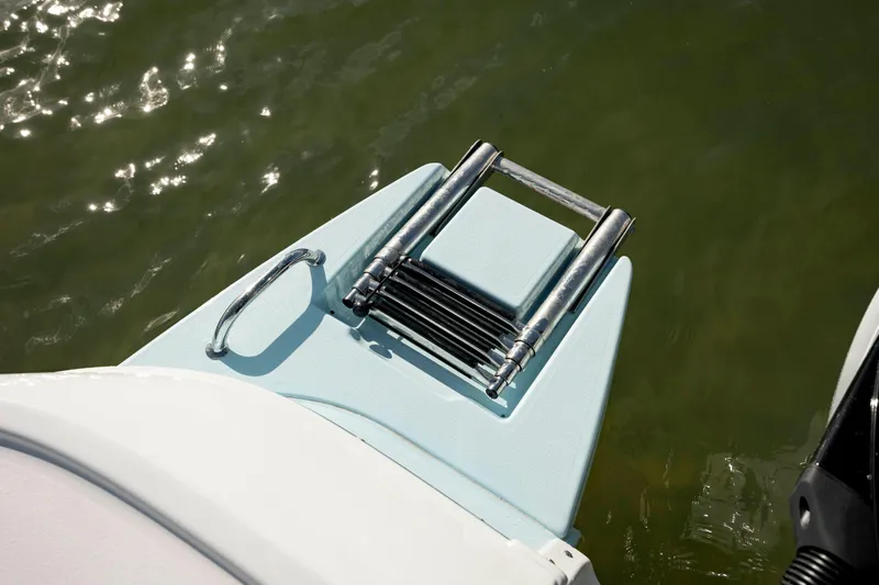  Yacht Photos Pics 2024 Caymas 281 HB boat with a folded swim ladder on the deck.