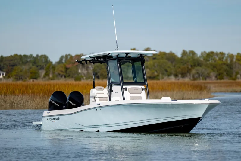  Yacht Photos Pics 2024 Caymas 281 HB boat on calm water with dual engines.