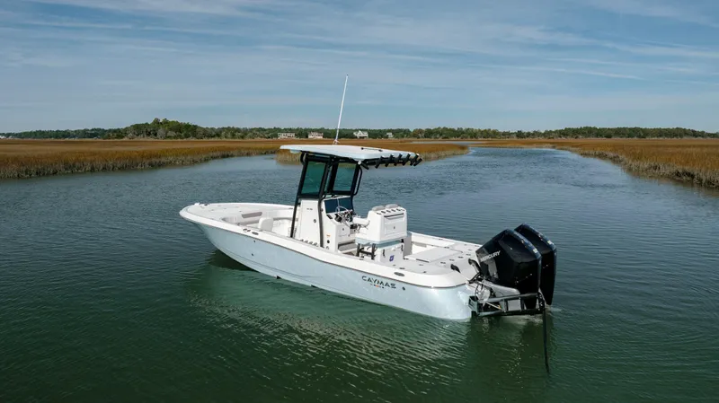 Yacht Photos Pics 2024 Caymas 281 HB boat in a serene waterway.