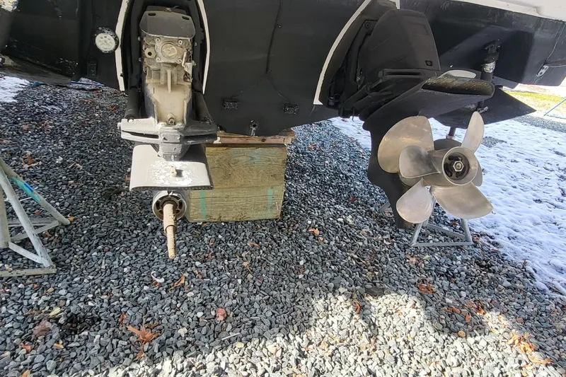  Yacht Photos Pics 2018 Regal 35 Sport Coupe boat propeller and drive system on gravel.