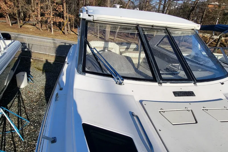  Yacht Photos Pics 2018 Regal 35 Sport Coupe boat with sleek design, docked outdoors.