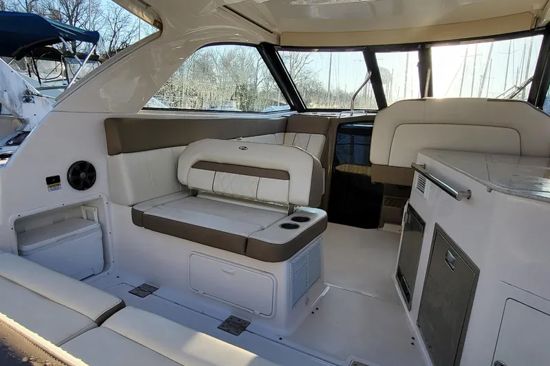  Yacht Photos Pics 2018 Regal 35 Sport Coupe interior with white seating and modern amenities.