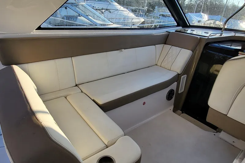  Yacht Photos Pics 2018 Regal 35 Sport Coupe interior with white and brown seating, featuring a sleek design.