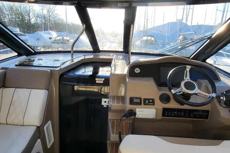  Yacht Photos Pics 2018 Regal 35 Sport Coupe helm with modern controls and panoramic windows.