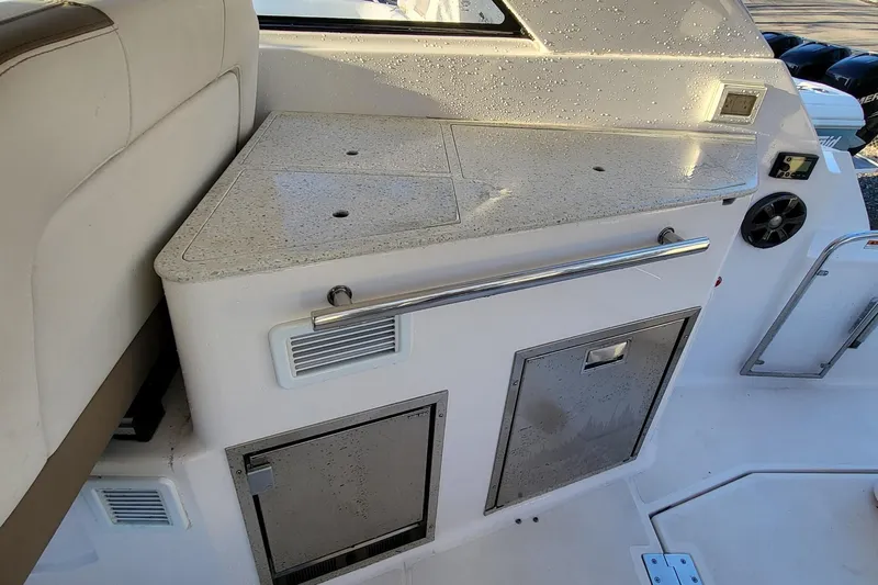  Yacht Photos Pics 2018 Regal 35 Sport Coupe interior with wet bar and storage compartments.