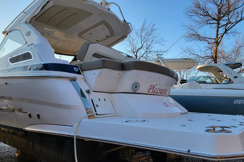  Yacht Photos Pics 2018 Regal 35 Sport Coupe boat docked, showcasing sleek design and spacious seating.