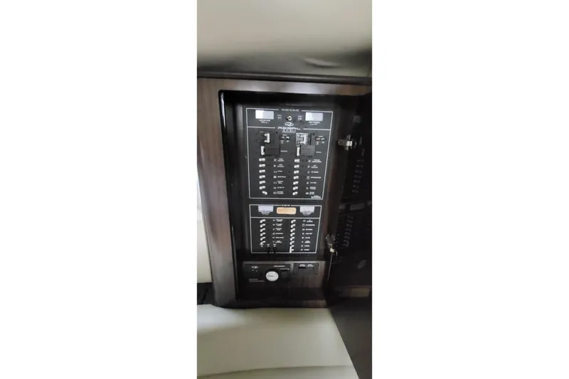  Yacht Photos Pics Control panel inside 2018 Regal 35 Sport Coupe boat, featuring switches and indicators.