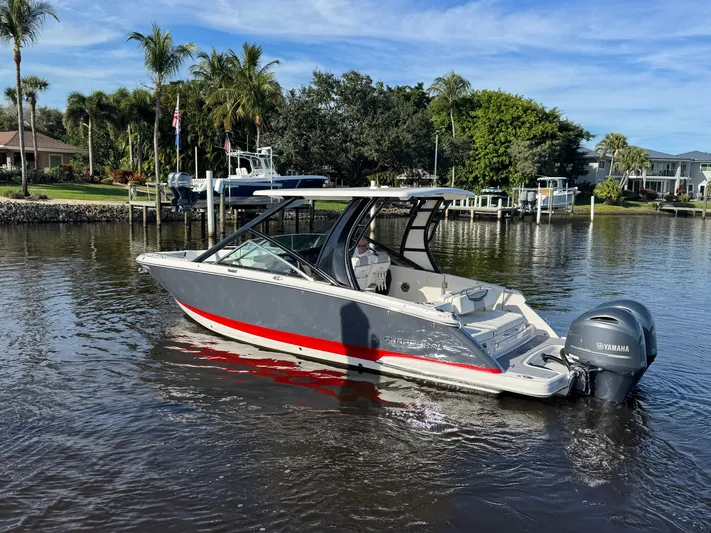  Yacht Photos Pics 2023 Chaparral 280 OSX boat on calm water.