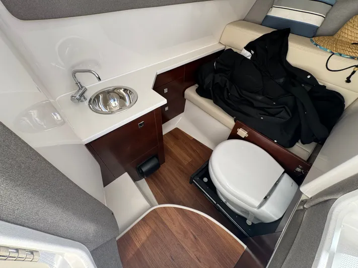  Yacht Photos Pics Interior of 2023 Chaparral 280 OSX with toilet and sink.