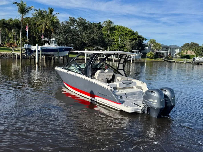  Yacht Photos Pics 2023 Chaparral 280 OSX boat on calm water.