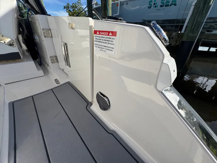  Yacht Photos Pics Chaparral 280 OSX 2023 boat passage with warning sign.