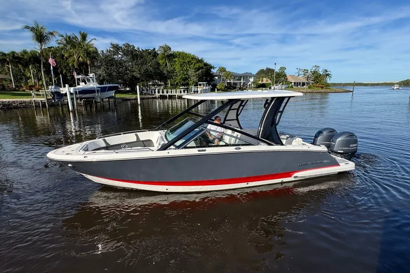  Yacht Photos Pics 2023 Chaparral 280 OSX boat on calm water.