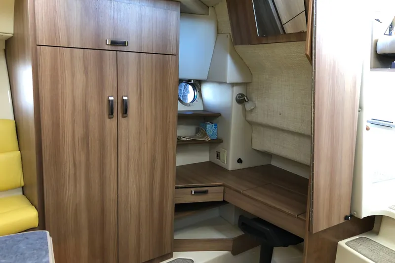  Yacht Photos Pics 2024 Ranger Tugs R-43 CB interior with wood cabinetry and cozy seating area.