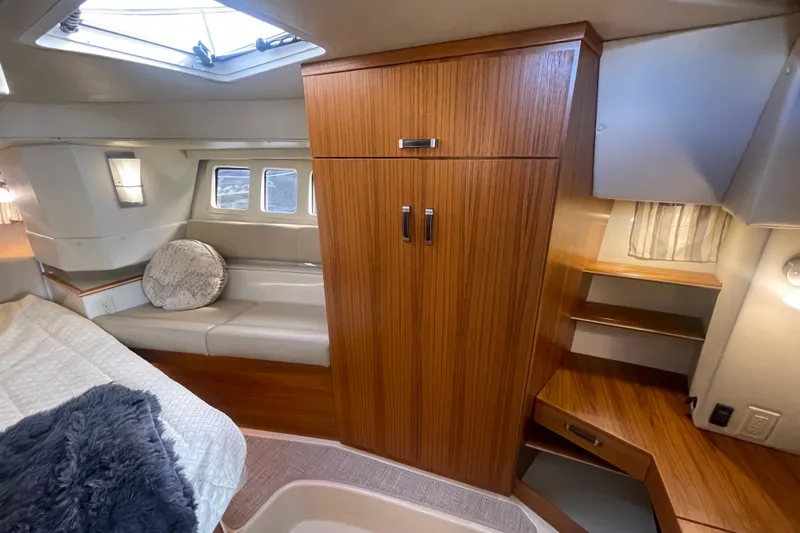  Yacht Photos Pics 2024 Ranger Tugs R-43 CB interior cabin with wood finish and cozy seating area.