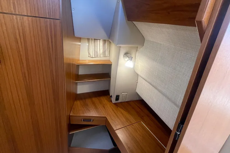  Yacht Photos Pics 2024 Ranger Tugs R-43 CB cabin interior with wooden finish and cozy lighting.