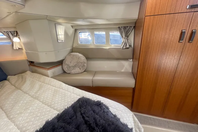  Yacht Photos Pics 2024 Ranger Tugs R-43 CB cabin interior with cozy bed and seating area.