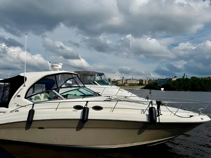  Yacht Photos Pics 2006 Sea Ray 340 Sundancer yacht docked on a cloudy day.