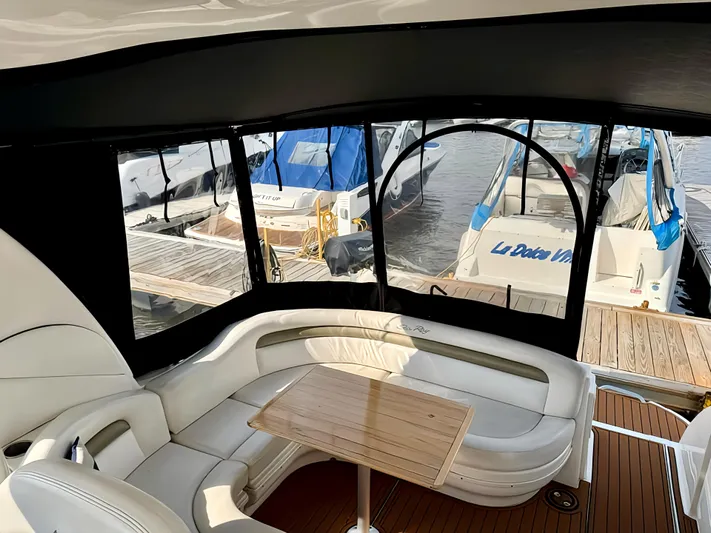  Yacht Photos Pics Interior view of 2006 Sea Ray 340 Sundancer yacht with docked boats outside.